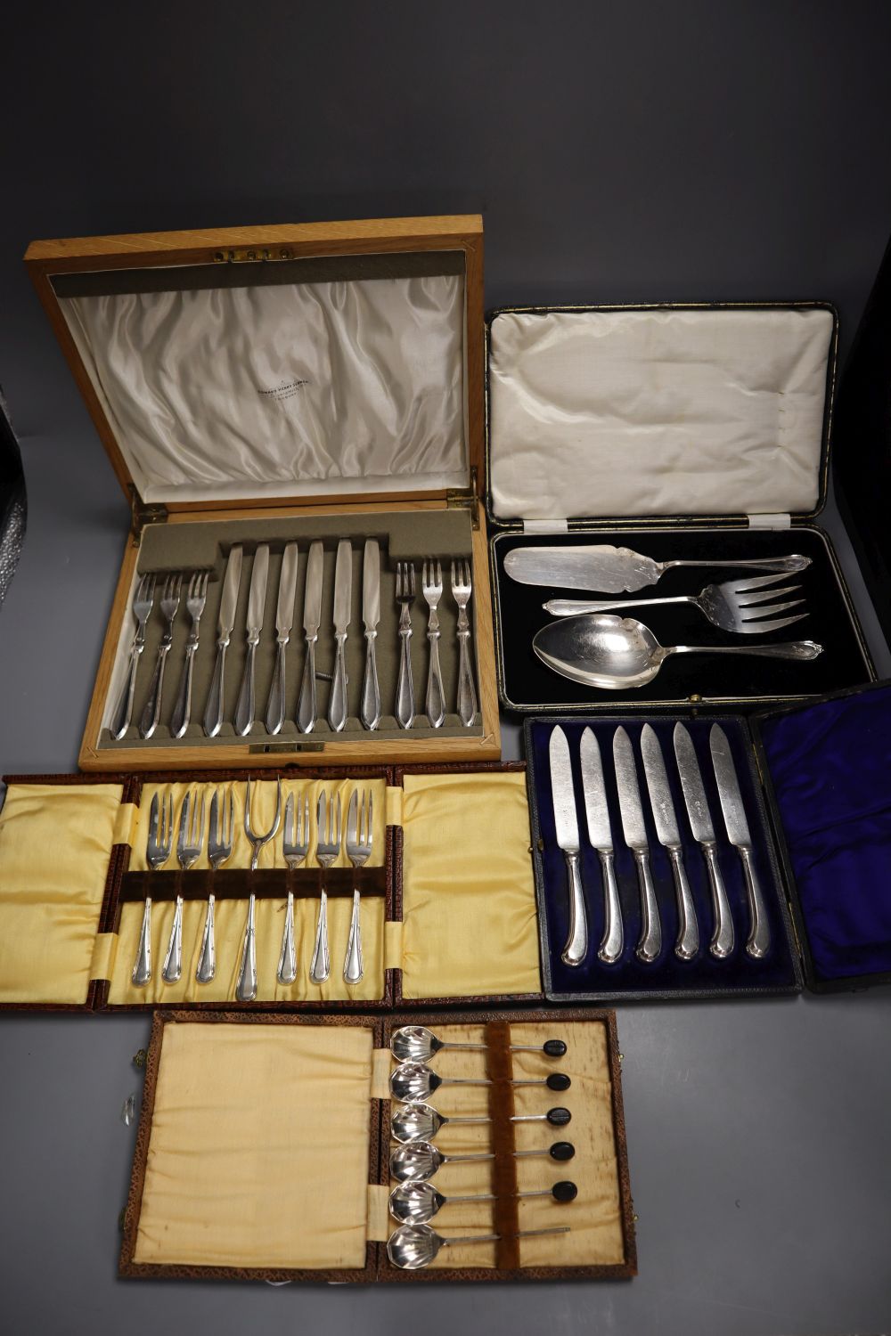 Five cases of plated cutlery.